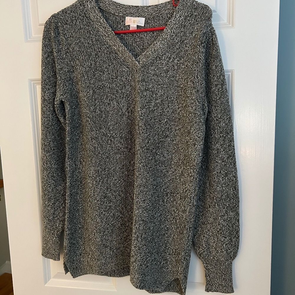 Puffed shoulder sweater by Kim Gravel.